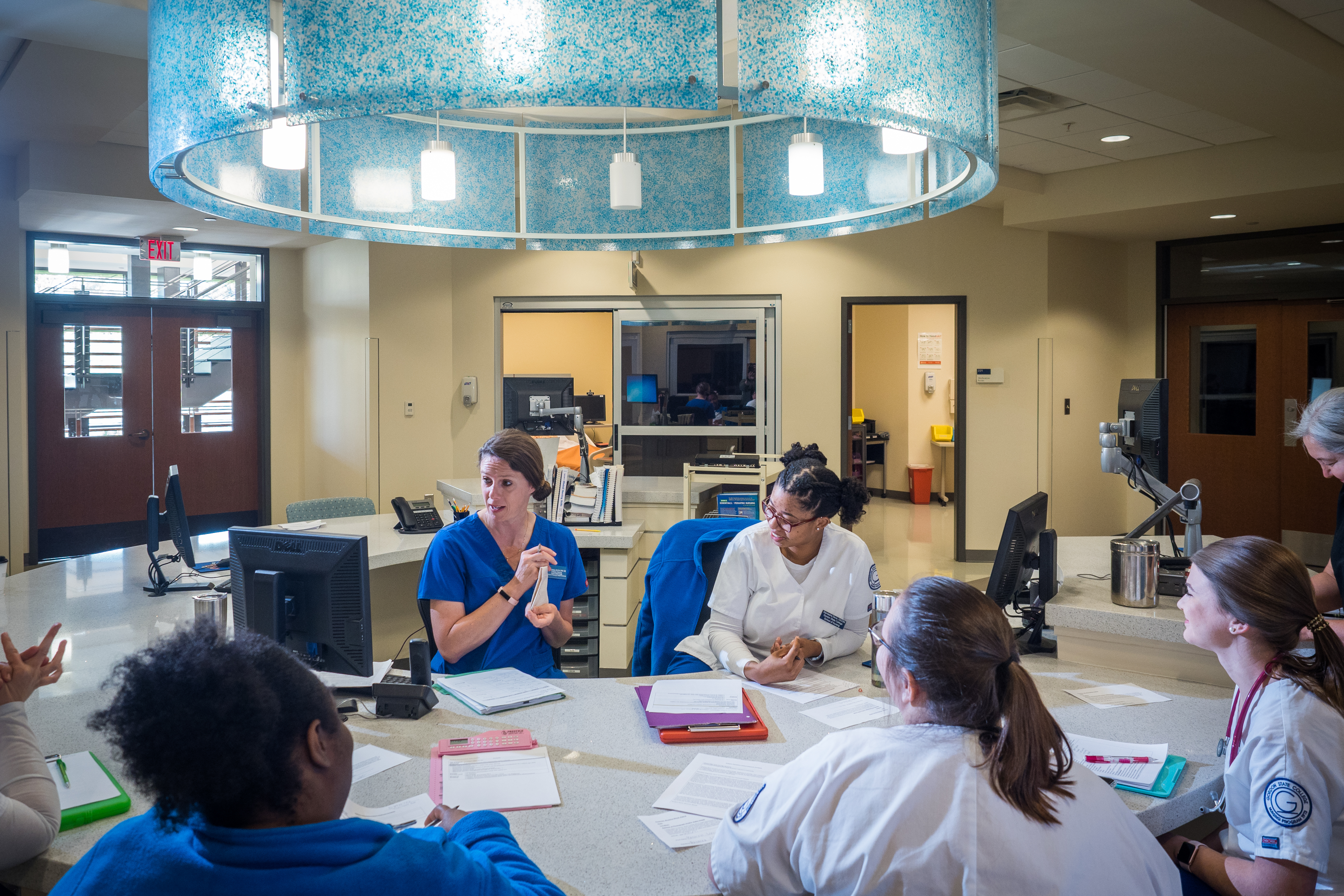 Gordon State College nursing students engage in collaborative clinical instruction during a lab session on campus.
