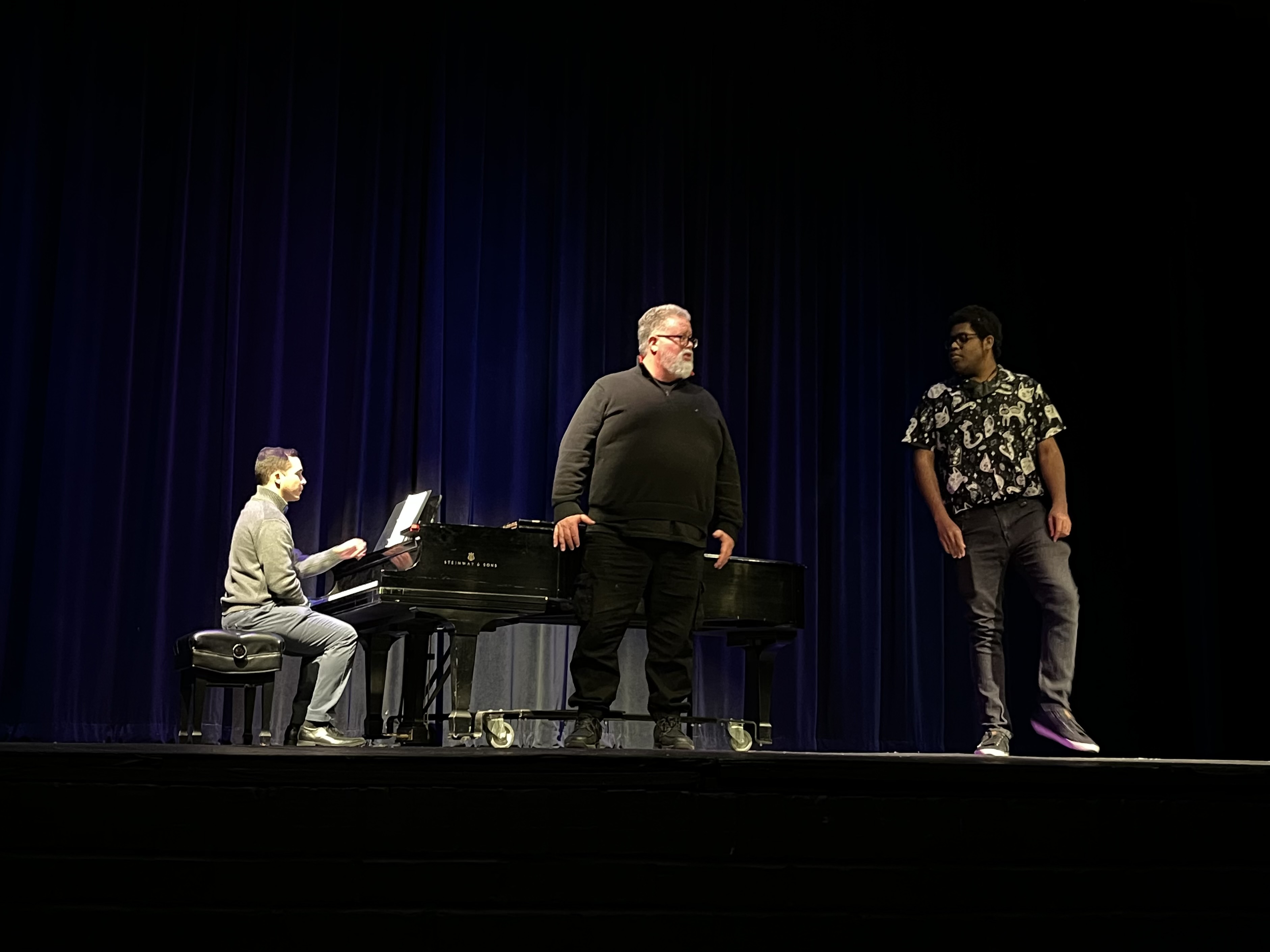 American tenor and voice teacher, Maestro Dallas Bono (center) working with students during a singing-focused session.