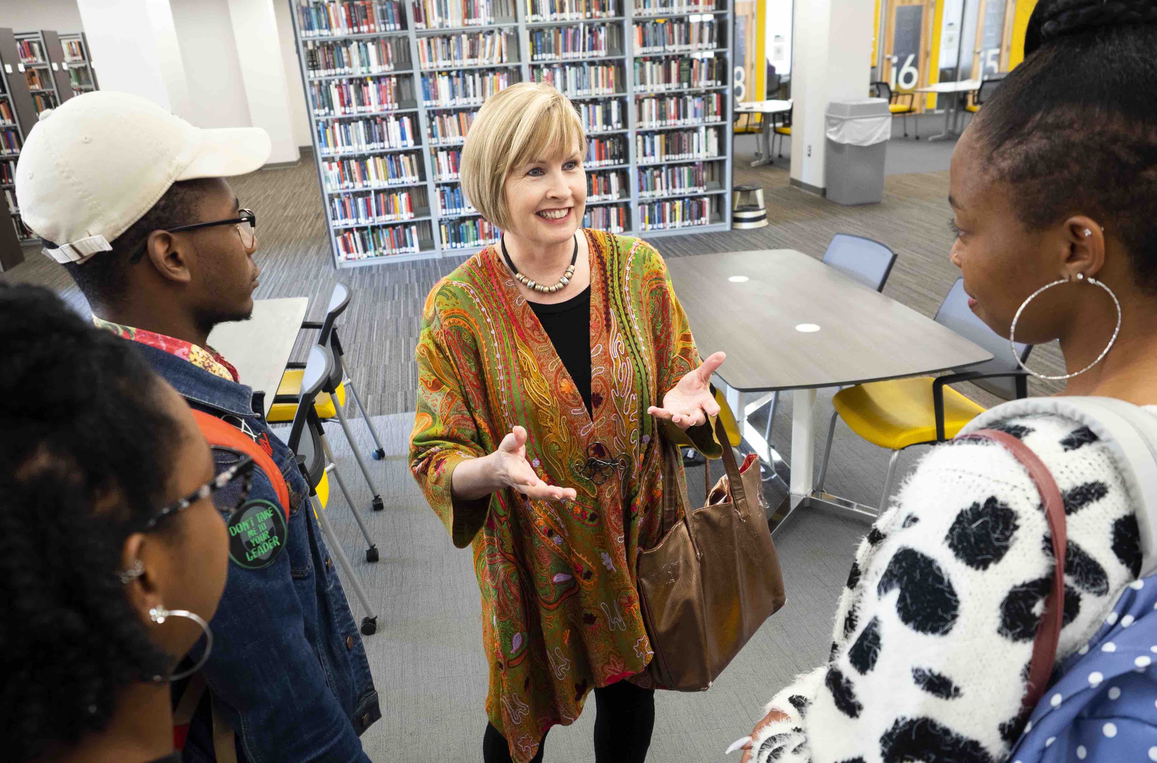 professor-with-students-in-library.jpg